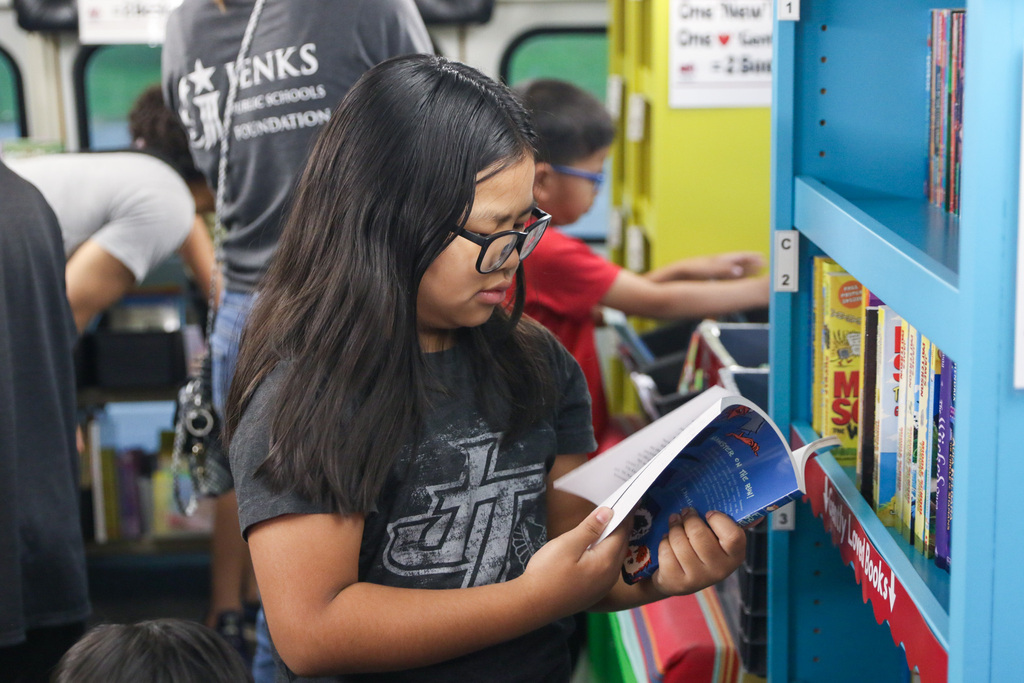 girl flipping through a book