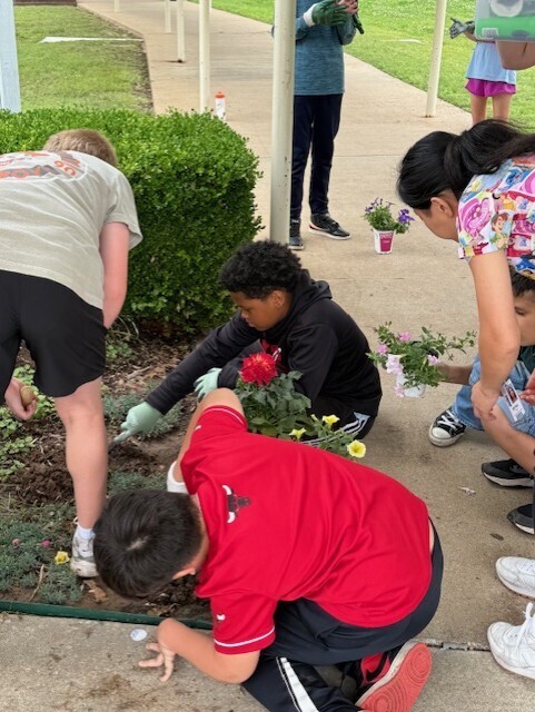 Peers with Purpose students planting flowers