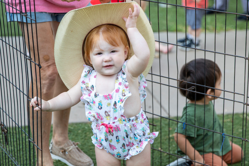 little girl with a large cowboy hat on