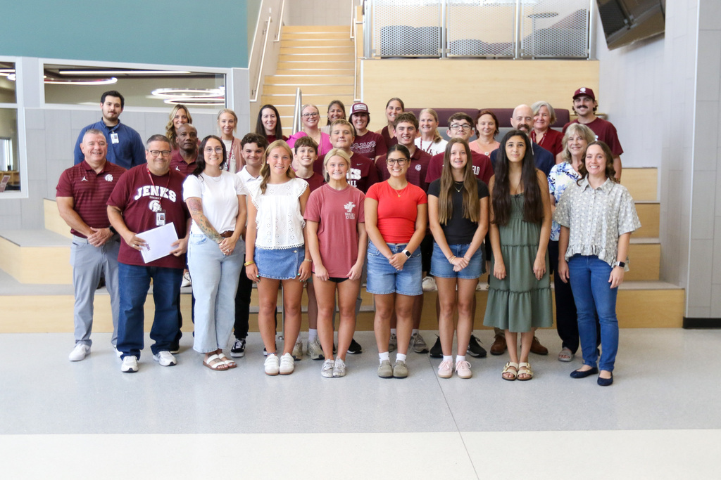 freshman academy staff and incoming freshman posing for a photo