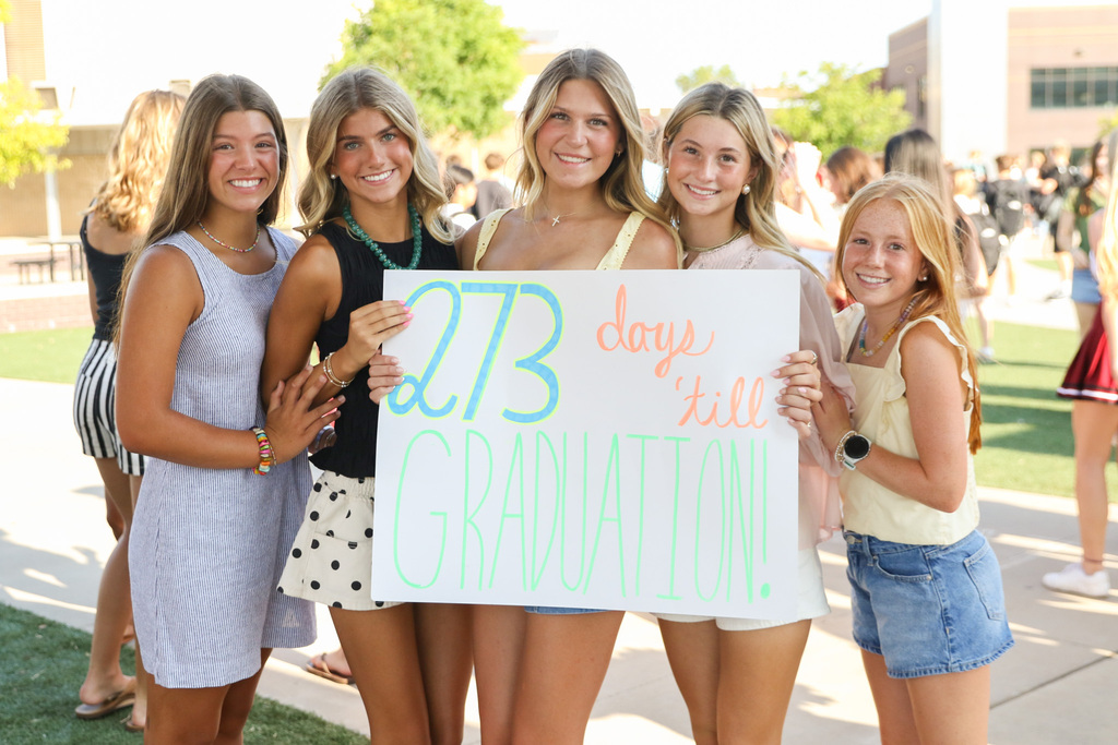 5 senior girls hold up a sign that says 273 days 'till graduation