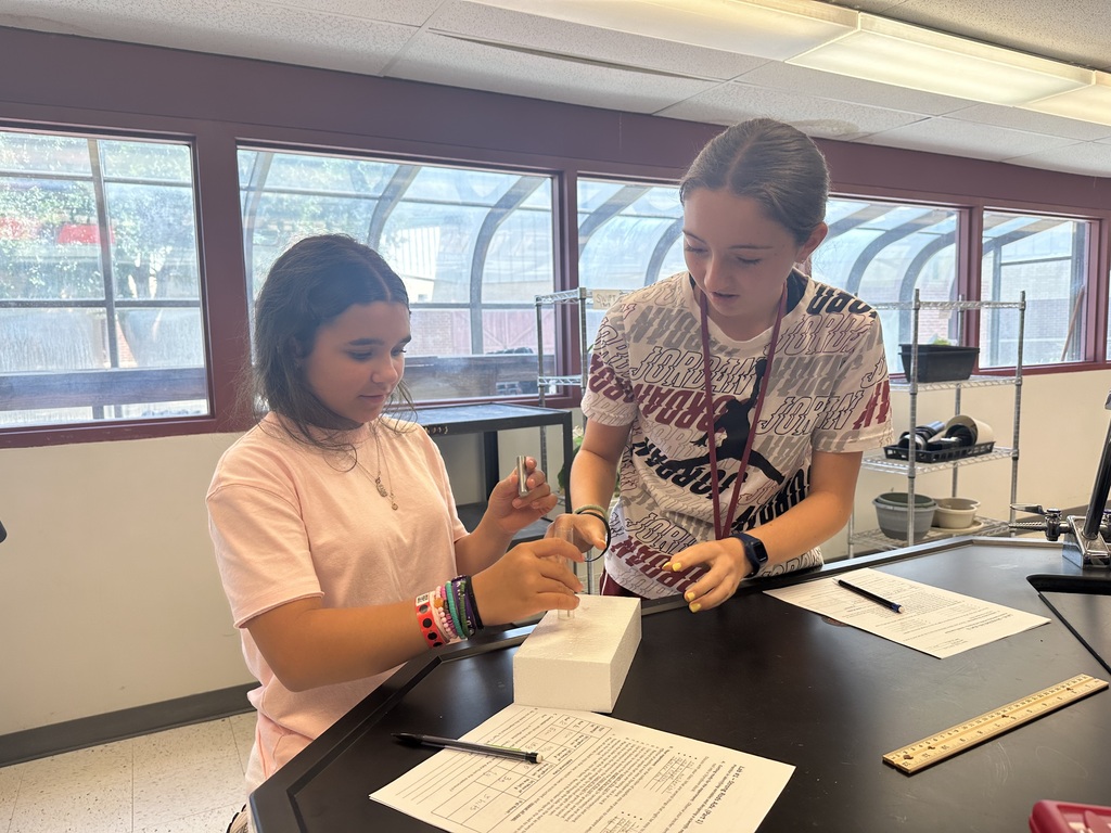 students working together of styrofoam experiment