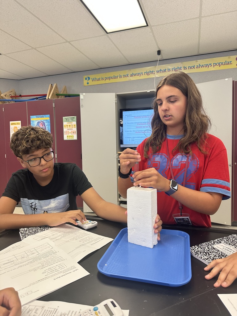 students working together of styrofoam experiment