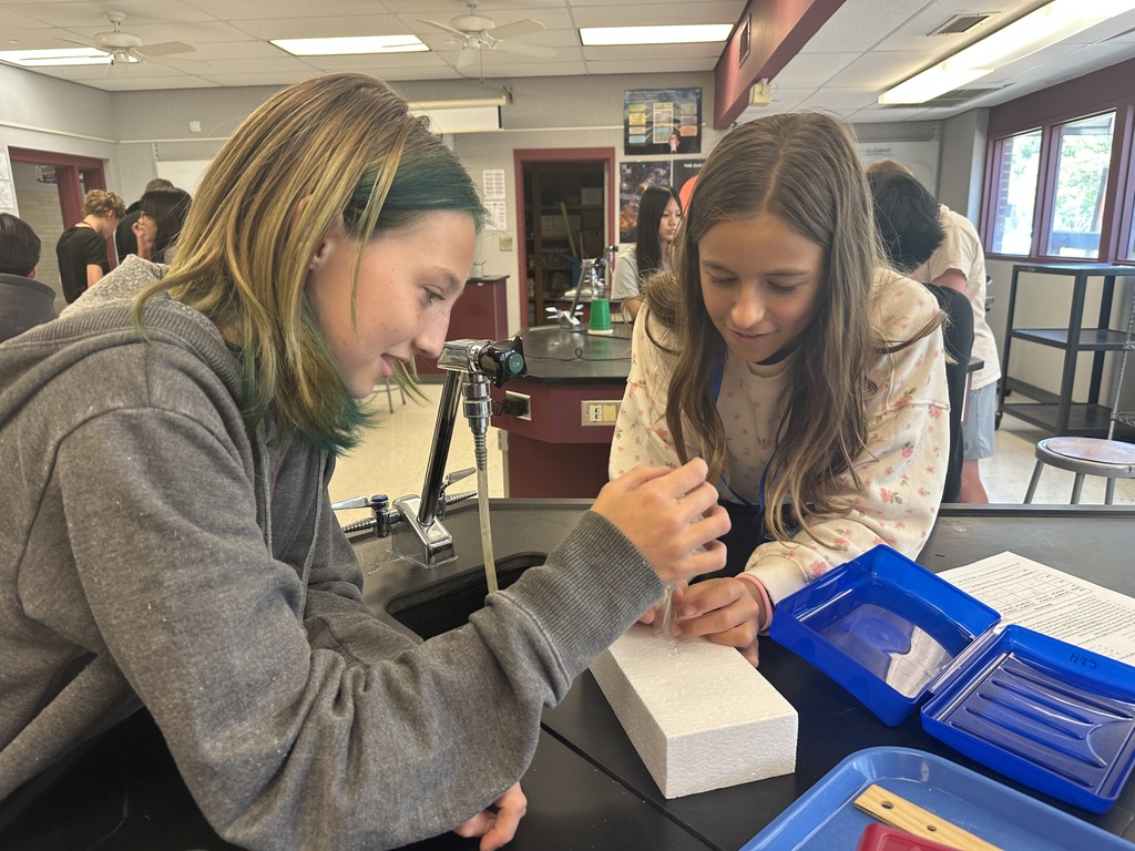 students working together of styrofoam experiment