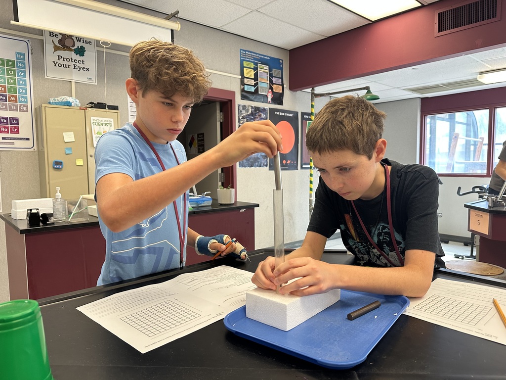 students working together of styrofoam experiment