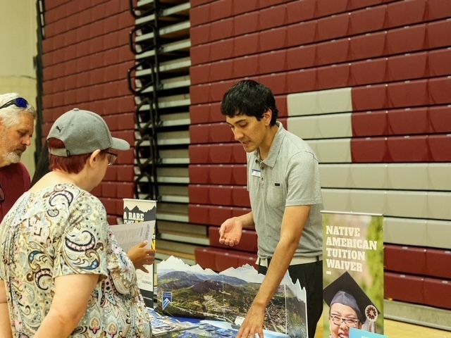 university representative speaking to a family