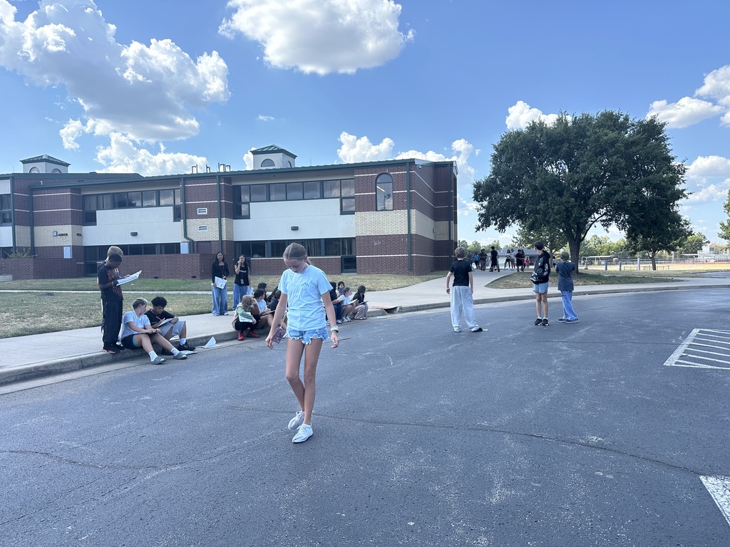 students in parking lot