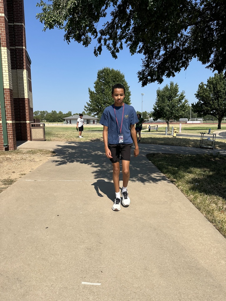 student walking outside