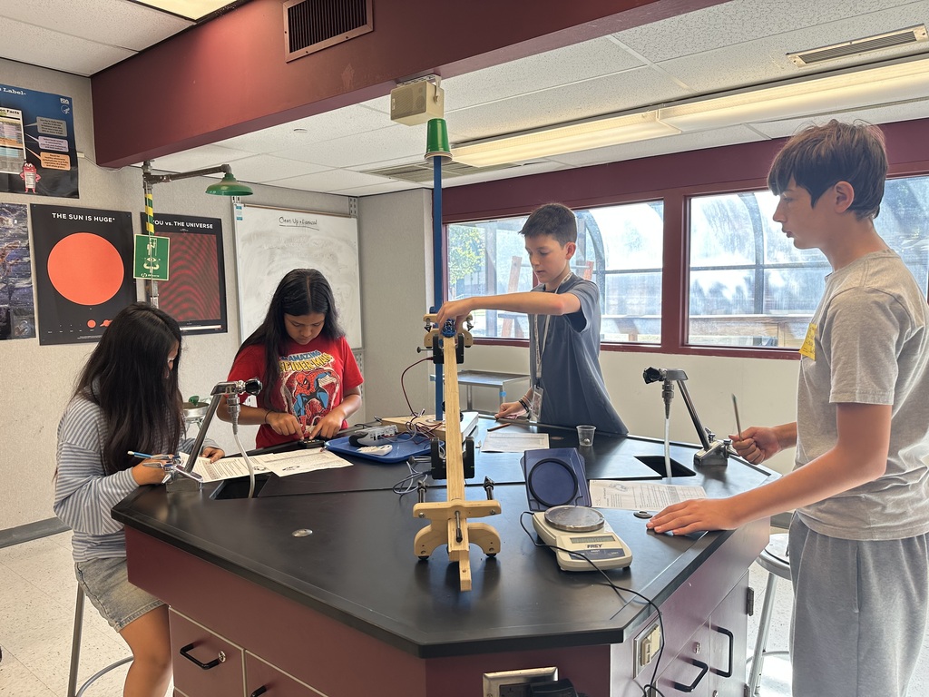 students working on a lab table project
