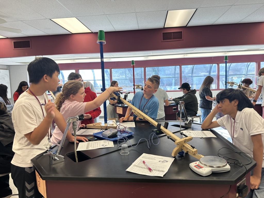 students working on a lab table project