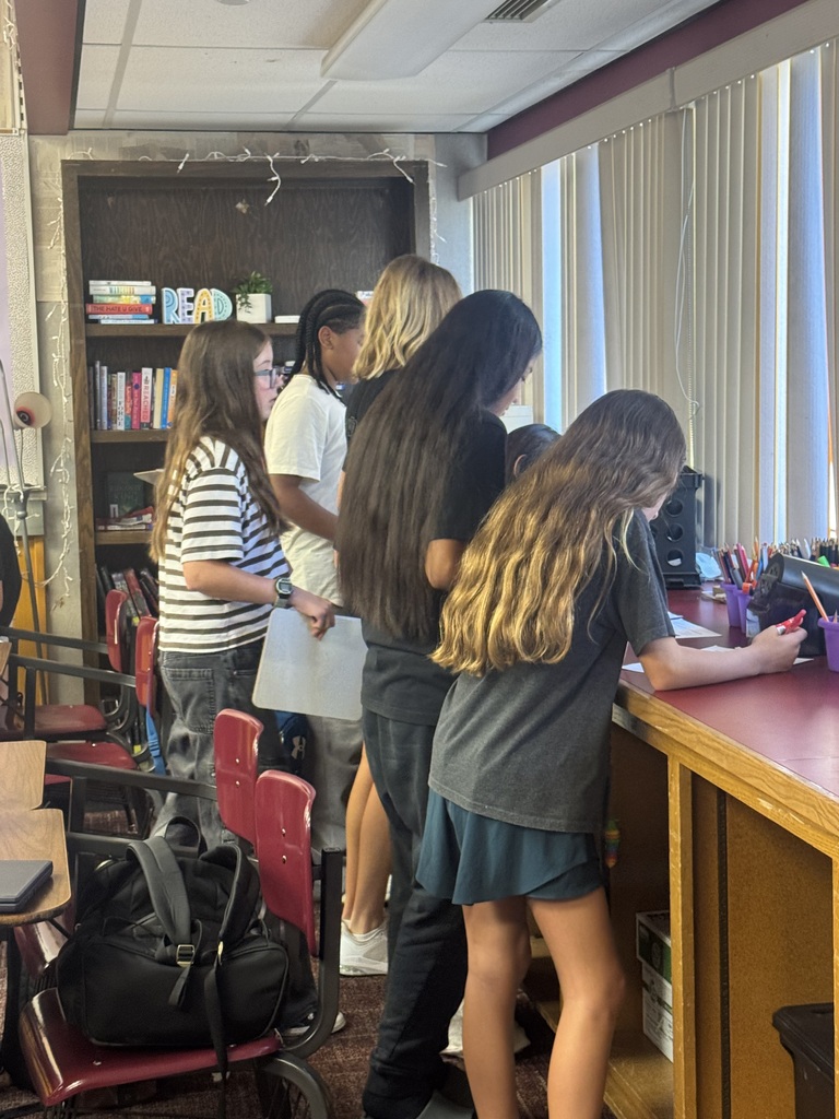 students working a grammar scavenger hunt