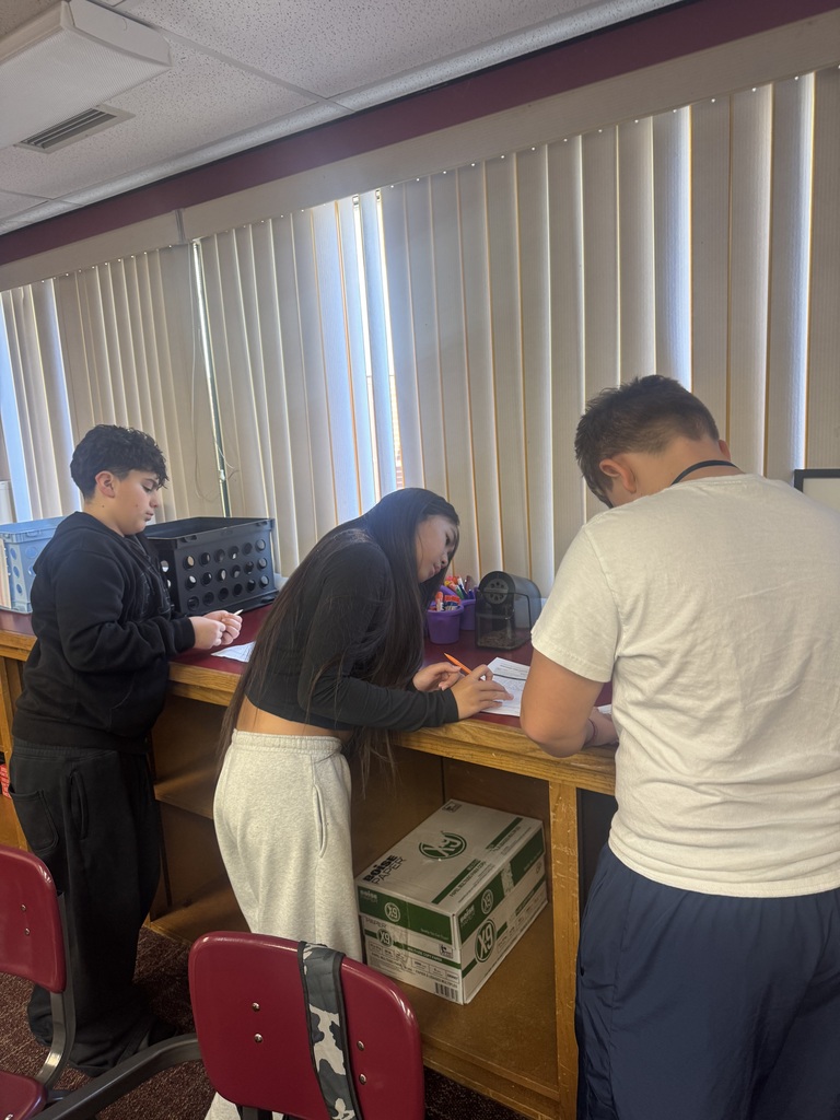 students working a grammar scavenger hunt