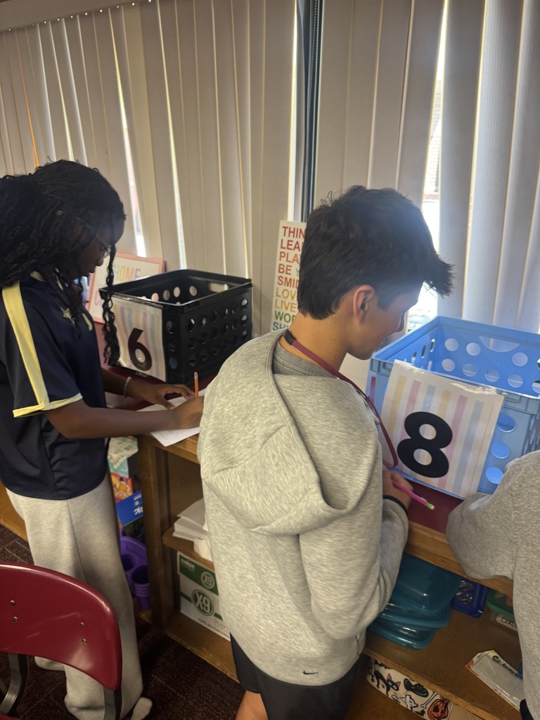 students working a grammar scavenger hunt