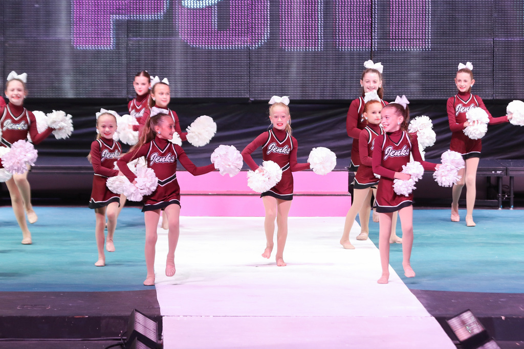 a younger pom squad performing their routine.