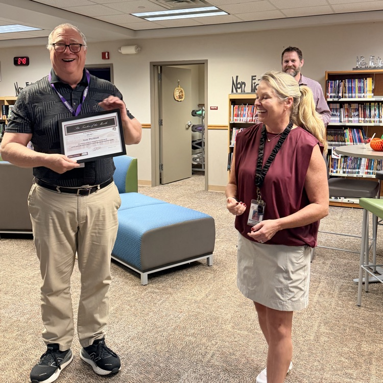 teacher receiving award