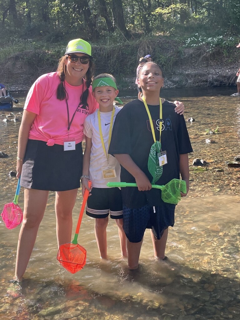 students and counselor in the water study at jenks wild