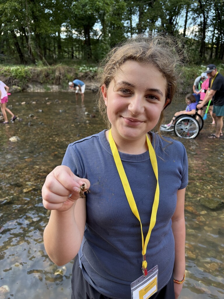 student with crawdad at jenks wild