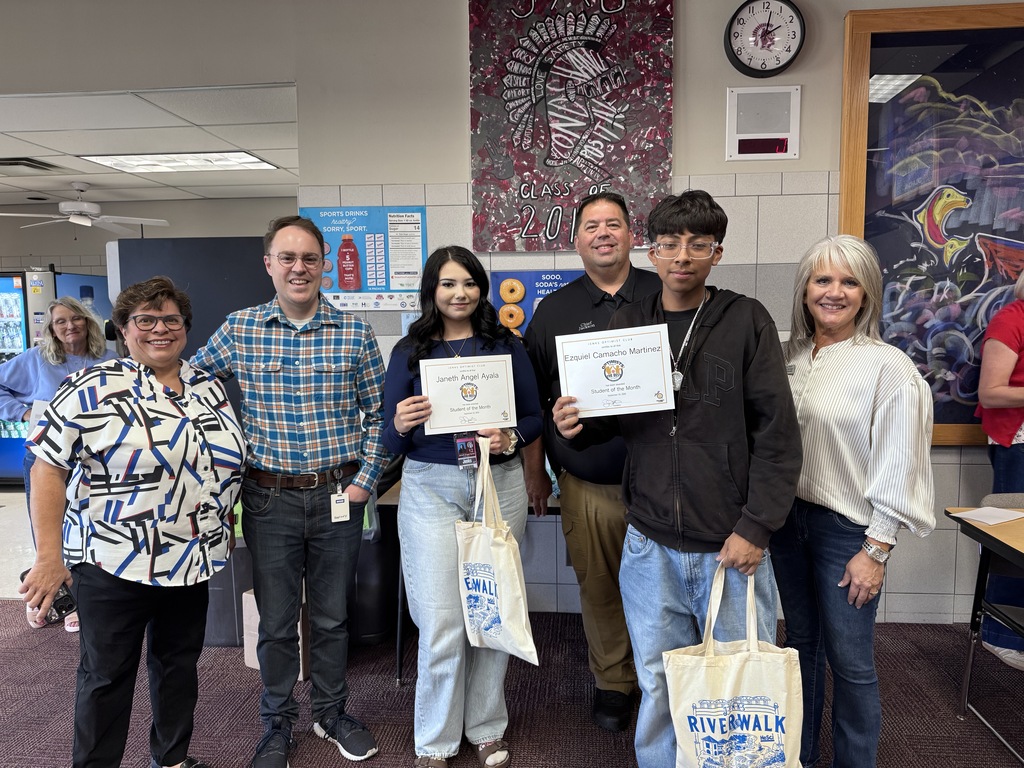 Jenks Optimist club members with two students 