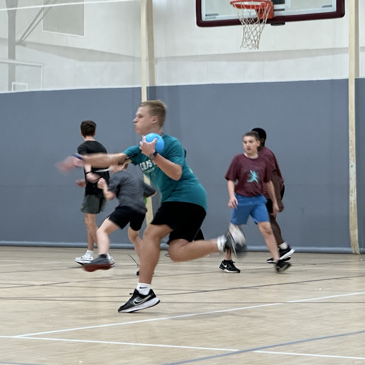 student throwing dodgeball
