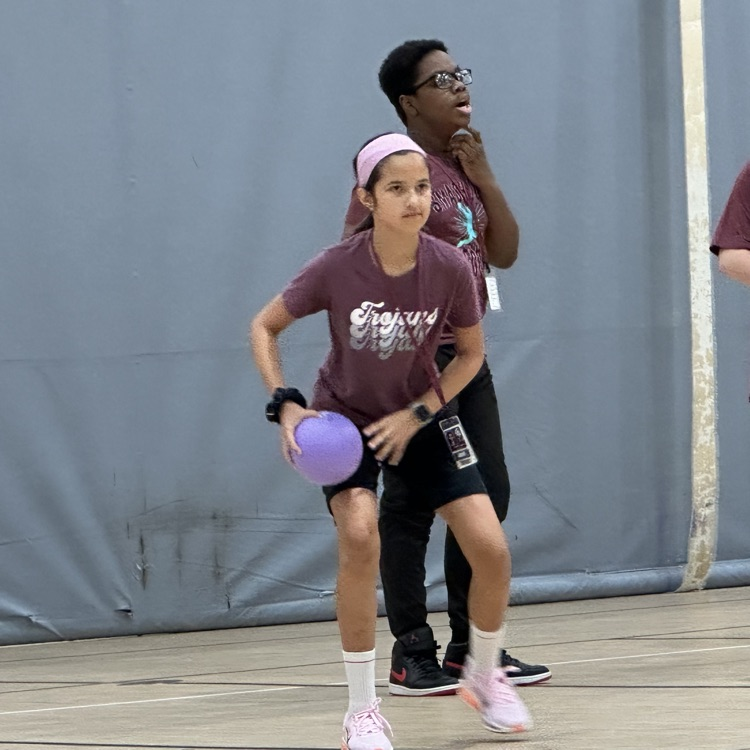 student ready to throw a dodgeball