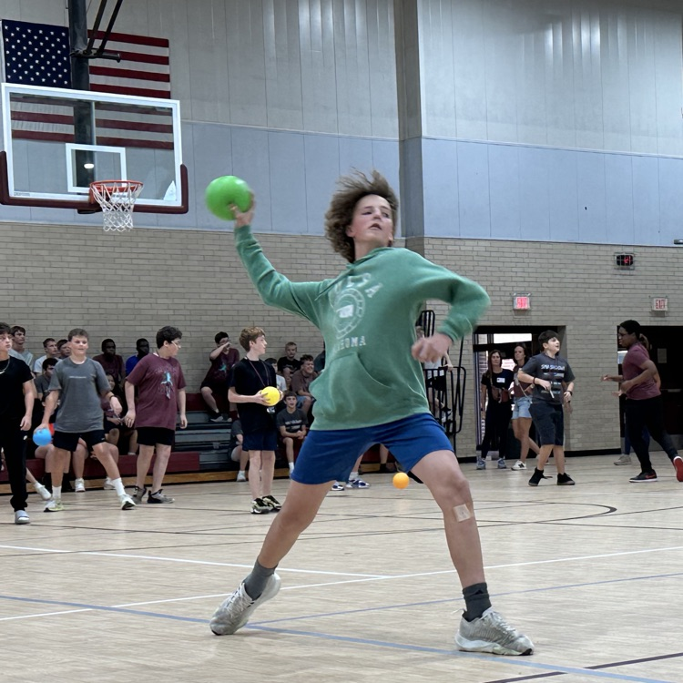 student launching a green dodgeball