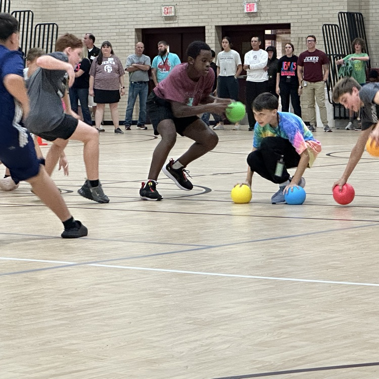 students gathering dodgeball