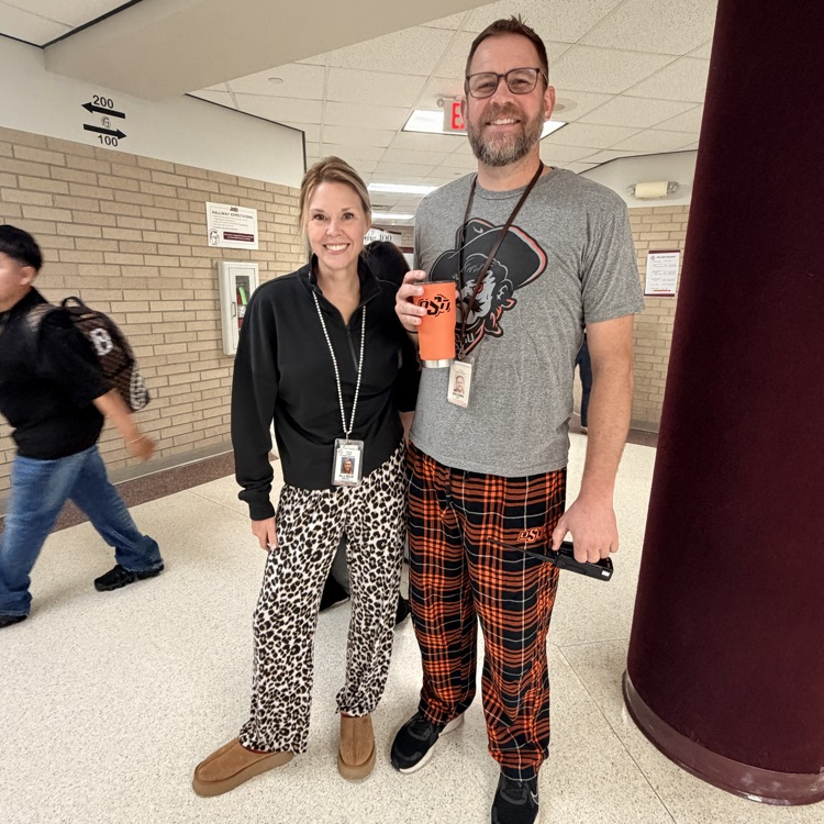two staff wearing pajamas