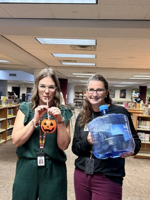 Mrs. Johnson & Mrs. Shelton holding their "not a cup"