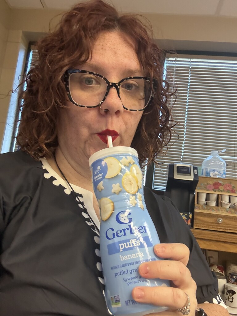Mrs. Cook drinking from her "not a cup"