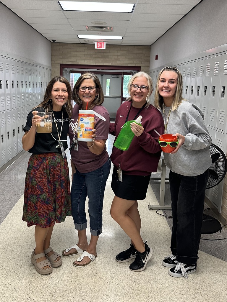 Team 7-5 teachers holding their "not a cup"