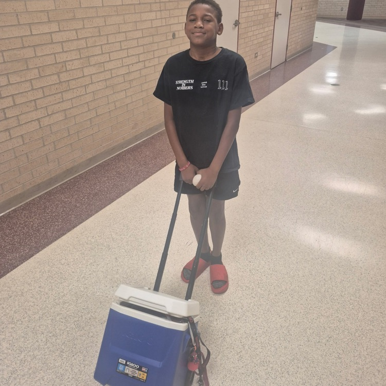 boy pulling an ice chest