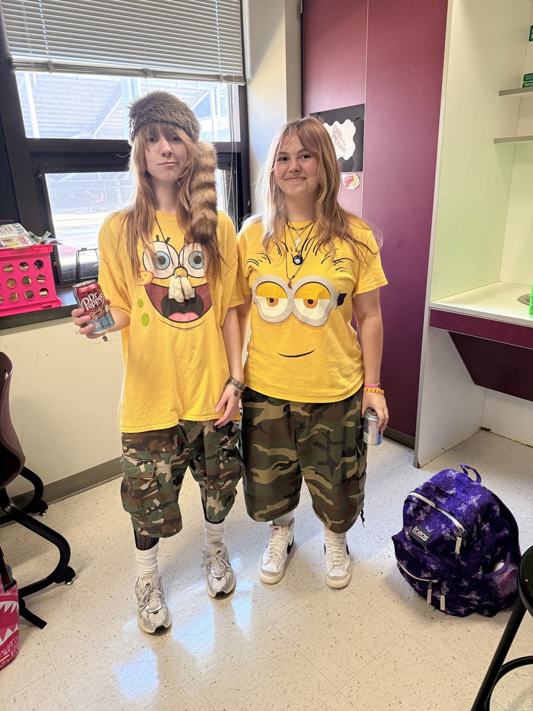 two students in yellow shirts