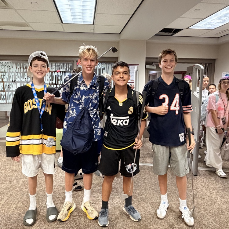 four boys dressed as Adam Sandler holding golf clubs