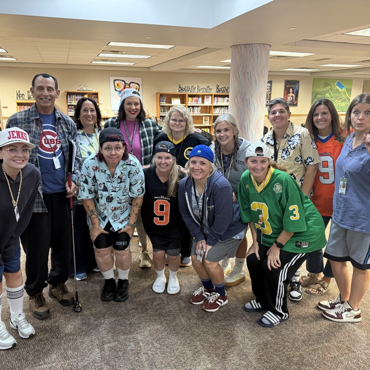 staff health and wellness committee dressed up as Adam Sandler