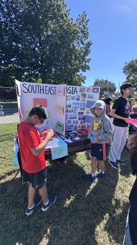 Global village students with booths at JEI