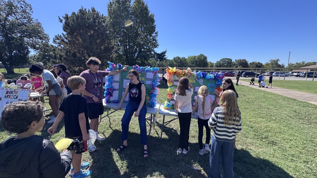 Global village students with booths at JEI