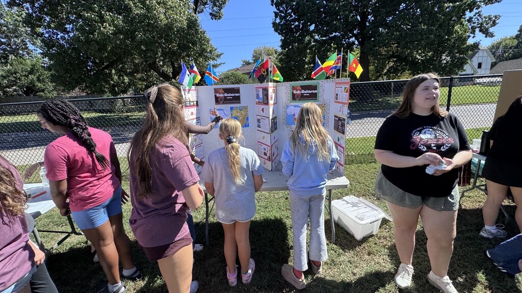 Global village students with booths at JEI