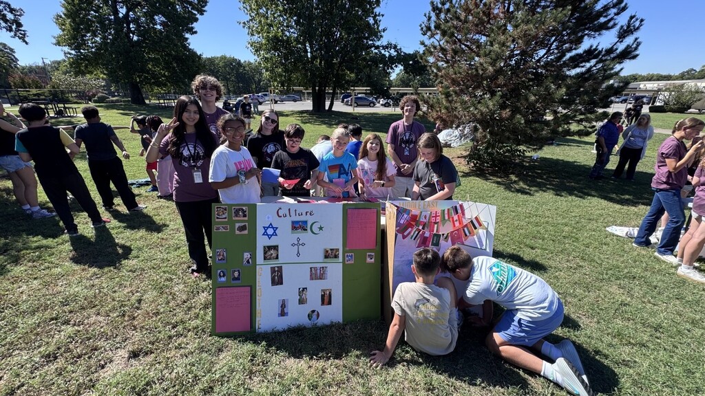 Global village students with booths at JEI
