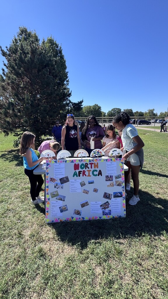 Global village students with booths at JEI