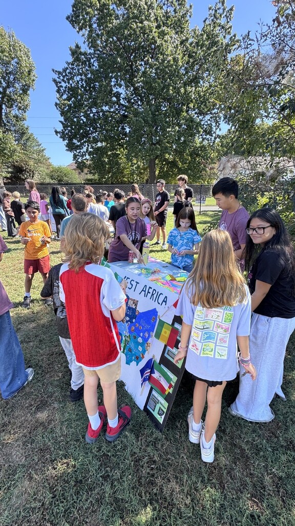 Global village students with booths at JEI