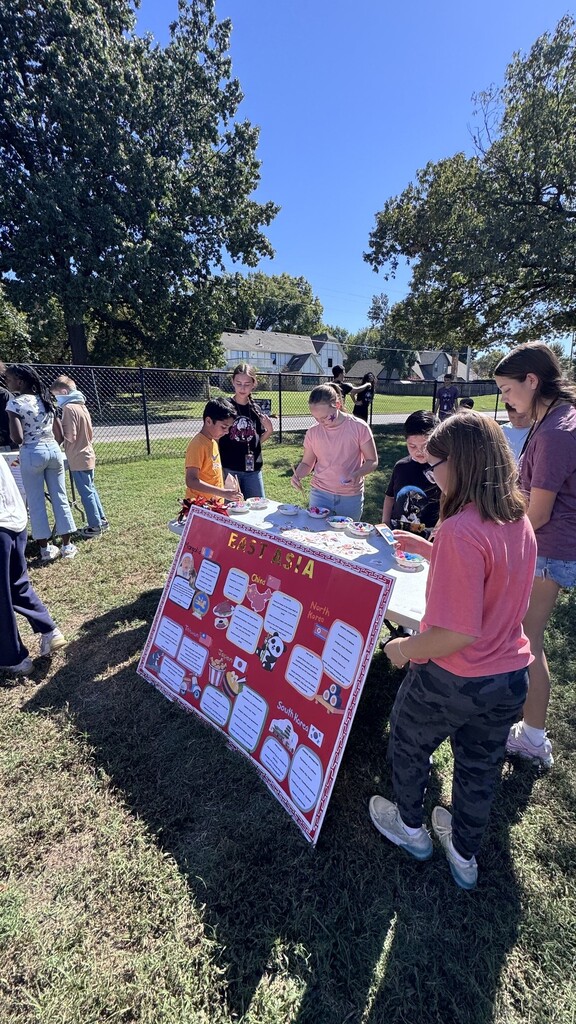 Global village students with booths at JEI