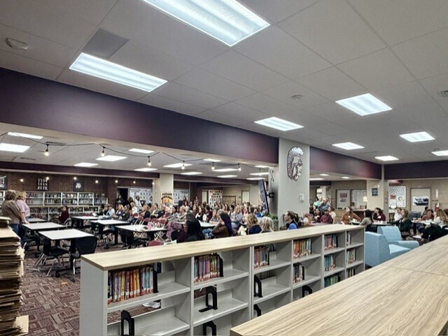 Marvelous moms guests gathering in the library