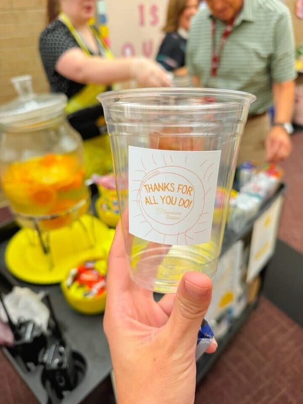 Cup with Yellow writing saying "Thanks for all you do"