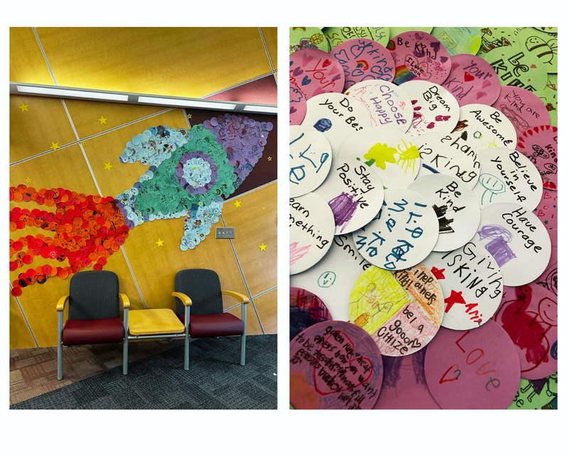 Rocketship mural with paper pieces that contain kindness messages