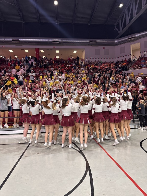 Jenks Pom celebrates with the crowd after winning the 2025 state title and academic state title