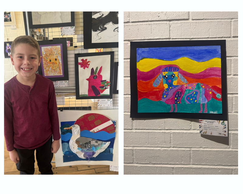 student standing next to artwork