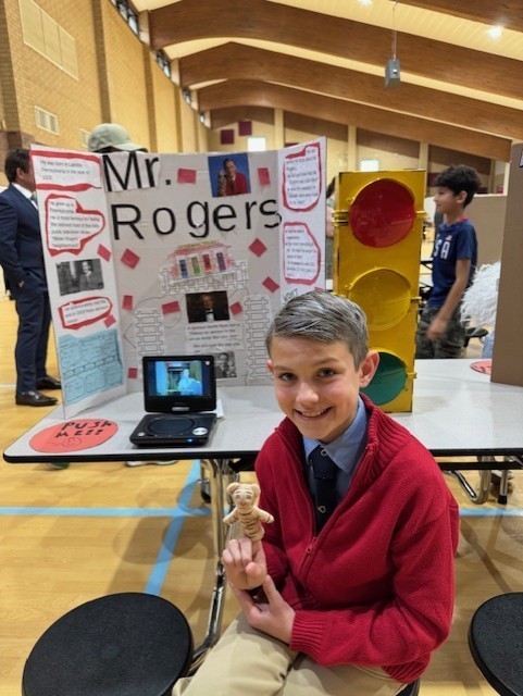 4th grader dressed up as Mr. Rogers