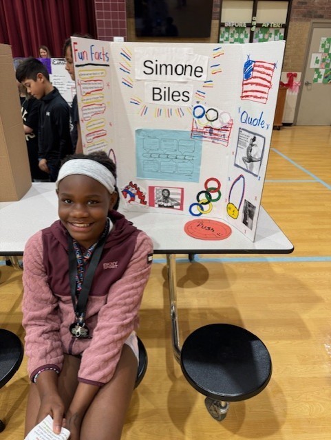 4th grader dressed up as Simone Biles