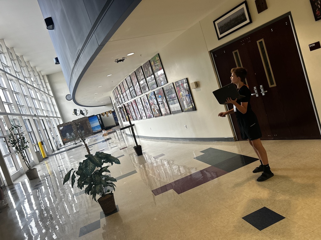 Student watching drone