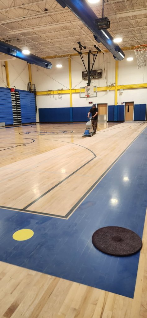 Nick begins sanding the floor